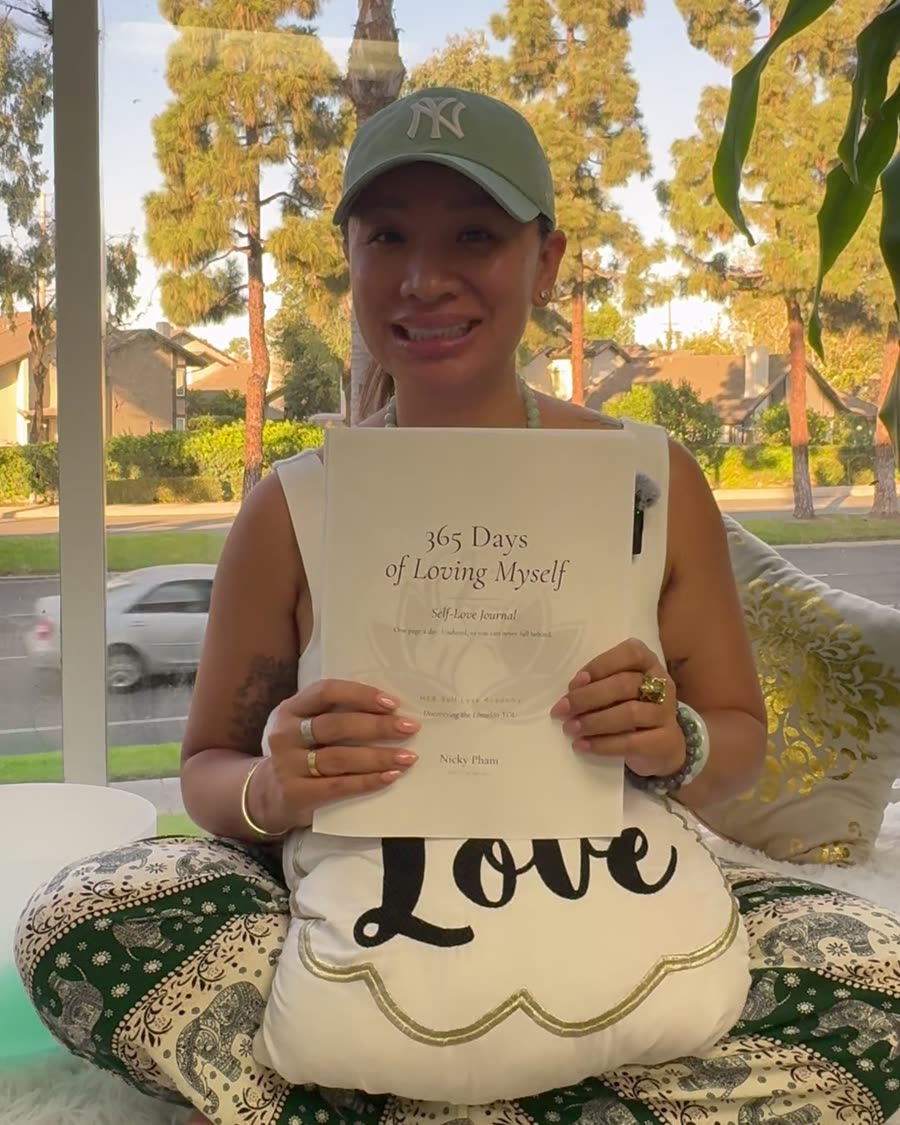 Nicky Pham holding 365 Days of Loving Myself